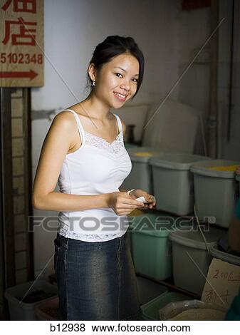 Woman shopping at a market View Large Photo Image Stock Photo - Woman shopping at a market. Fotosearch