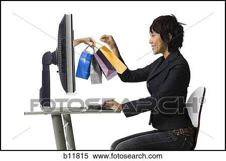 Stock Photography - Woman shopping online. Fotosearch