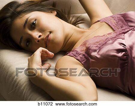 Stock Image - Woman smiling and relaxing. Fotosearch