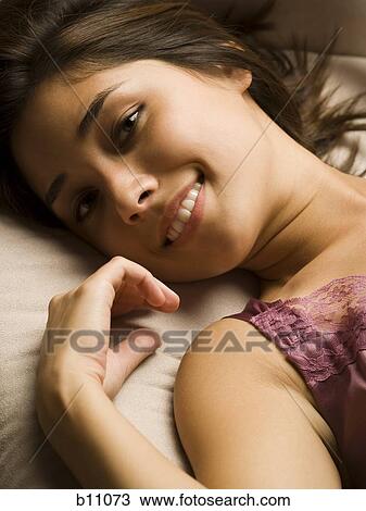 Woman smiling and relaxing View Large Photo Image Stock Image - Woman smiling and relaxing. Fotosearch