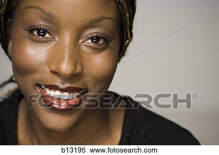 Stock Photography - Woman smiling with copy space. Fotosearch