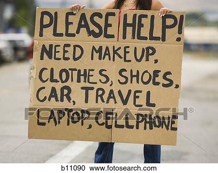 Stock Image - Woman standing on side of road soliciting. Fotosearch