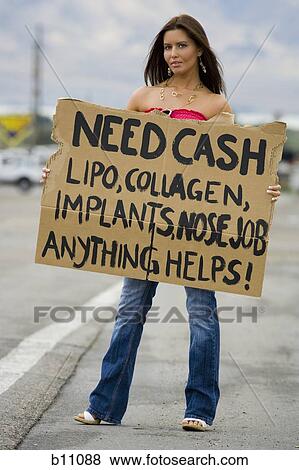 Woman standing on side of road soliciting cash View Large Photo Image Stock Photo - Woman standing on side of road soliciting cash. Fotosearch