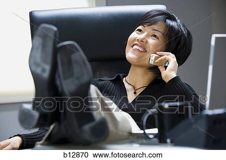 Woman talking on cell phone View Large Photo Image Stock Image - Woman talking on cell phone. Fotosearch