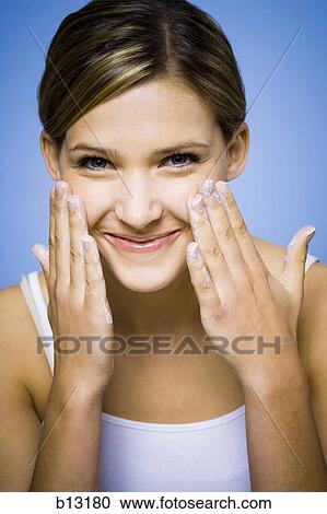 Woman washing face View Large Photo Image Stock Image - Woman washing face. Fotosearch