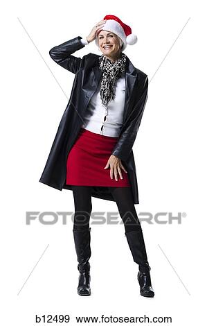 Woman wearing a Santa hat View Large Photo Image Stock Photo - Woman wearing a Santa hat. Fotosearch