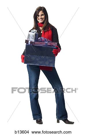 Woman with Christmas gifts posing View Large Photo Image Picture - Woman with Christmas gifts posing. Fotosearch