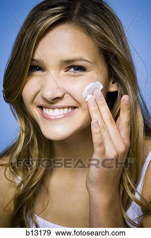 Woman with cleansing cream View Large Photo Image Stock Photo - Woman with cleansing cream. Fotosearch
