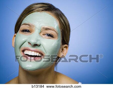 Woman with facial mask smiling with copy space View Large Photo Image Picture - Woman with facial mask smiling with copy space. Fotosearch