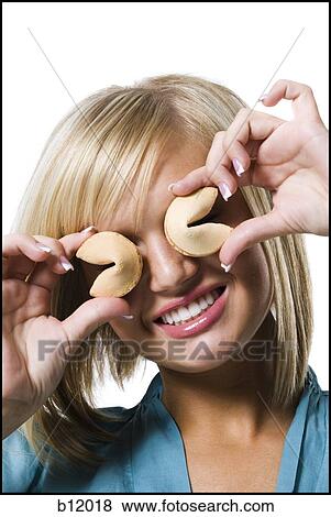 Stock Photo - Woman with fortune cookies. Fotosearch