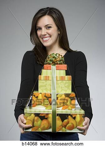 Woman with gift boxes smiling View Large Photo Image Stock Photo - Woman with gift boxes smiling. Fotosearch