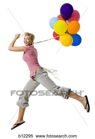 Woman with helium balloons View Large Photo Image Stock Photography - Woman with helium balloons. Fotosearch