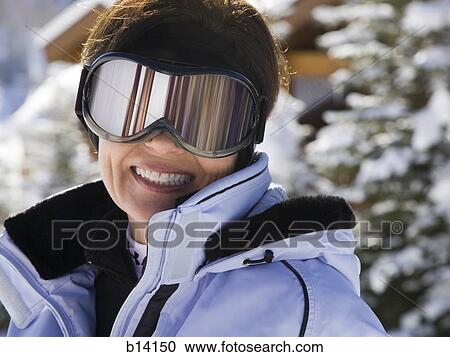 Woman with ski goggles outdoors in winter View Large Photo Image Stock Image - Woman with ski goggles outdoors in winter. Fotosearch