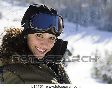 Woman with ski goggles outdoors in winter View Large Photo Image Stock Image - Woman with ski goggles outdoors in winter. Fotosearch