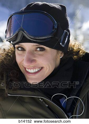 Woman with ski goggles outdoors in winter View Large Photo Image Stock Image - Woman with ski goggles outdoors in winter. Fotosearch