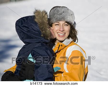 Woman with young girl outdoors in winter View Large Photo Image Stock Image - Woman with young girl outdoors in winter. Fotosearch