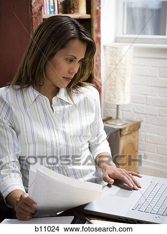 Woman working in home office View Large Photo Image Picture - Woman working in home office. Fotosearch