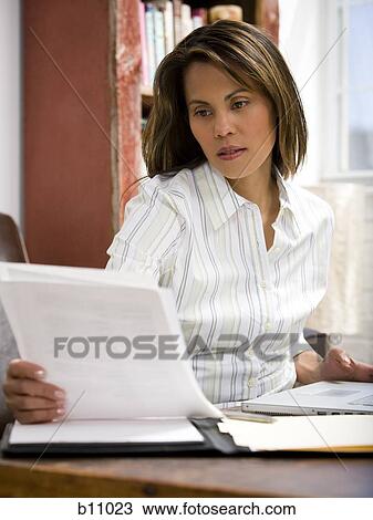 Woman working in home office View Large Photo Image Stock Image - Woman working in home office. Fotosearch