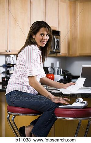 Woman working in home office View Large Photo Image Stock Photo - Woman working in home office. Fotosearch