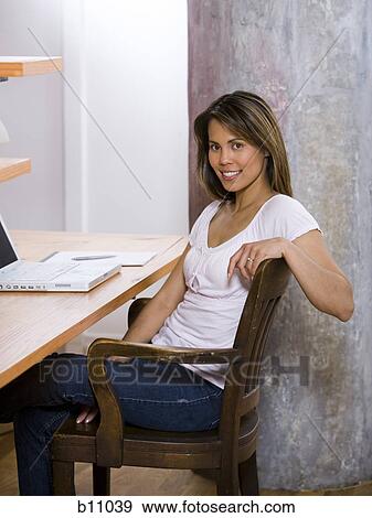 Woman working in home office View Large Photo Image Stock Photo - Woman working in home office. Fotosearch