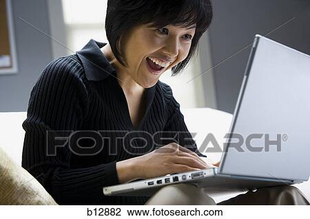 Woman working on laptop View Large Photo Image Stock Image - Woman working on laptop. Fotosearch