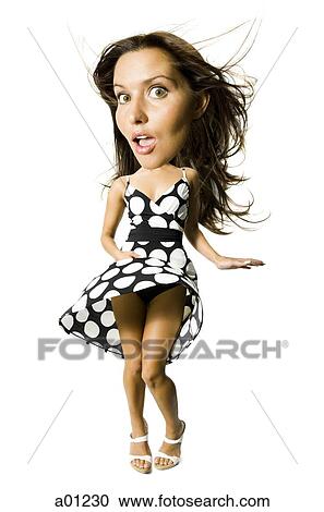 Woman's polka dot dress blowing in breeze View Large Photo Image Stock Image - Woman's polka dot dress blowing in breeze. Fotosearch