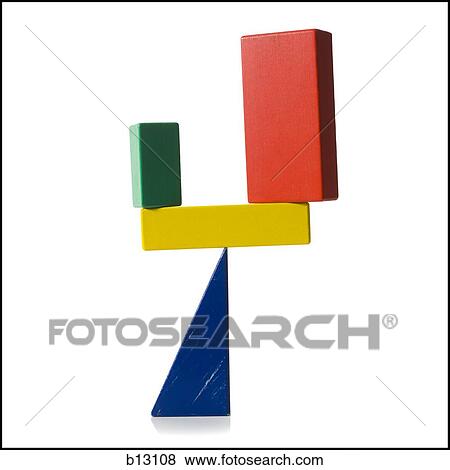 Wooden blocks precariously balancing on triangle View Large Photo Image Stock Photo - Wooden blocks precariously balancing on triangle. Fotosearch