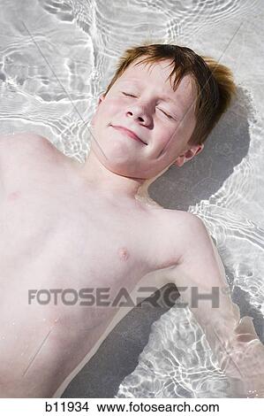 Picture - Young boy in wading pool. Fotosearch