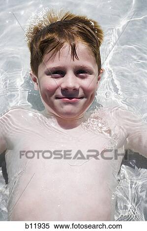 Young boy in wading pool View Large Photo Image Stock Photography - Young boy in wading pool. Fotosearch