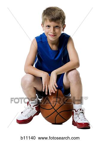 Young boy playing basketball View Large Photo Image Stock Image - Young boy playing basketball. Fotosearch