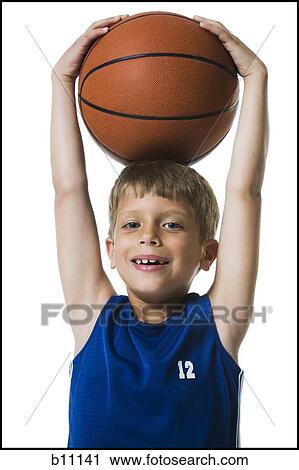 Young boy playing basketball View Large Photo Image Stock Image - Young boy playing basketball. Fotosearch