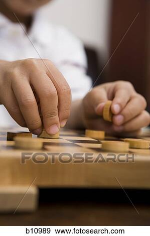 Young boy playing checkers View Large Photo Image Stock Photo - Young boy playing checkers. Fotosearch
