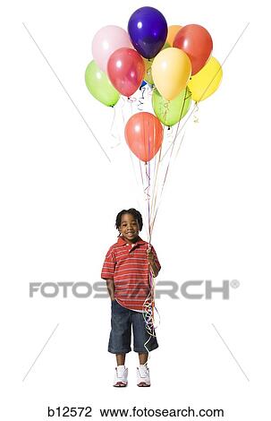 Young boy with balloons View Large Photo Image Stock Image - Young boy with balloons. Fotosearch