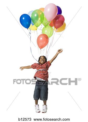 Young boy with balloons View Large Photo Image Stock Image - Young boy with balloons. Fotosearch