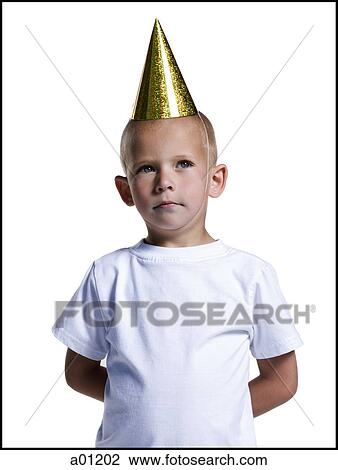 Young boy with party hat holding hands behind back View Large Photo Image Stock Image - Young boy with party hat holding hands behind back. Fotosearch