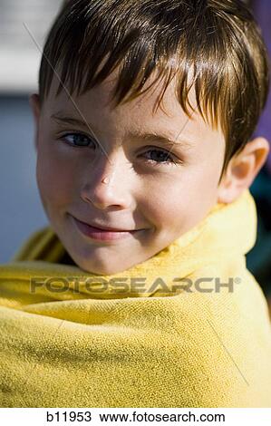 Young boy wrapped in a towel View Large Photo Image Stock Image - Young boy wrapped in a towel. Fotosearch