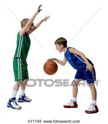 Young boys playing basketball View Large Photo Image Stock Image - Young boys playing basketball. Fotosearch