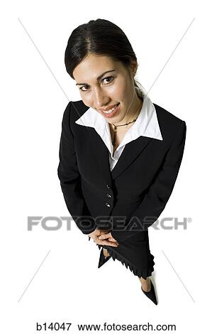 Young businesswoman smiling from above View Large Photo Image Stock Photo - Young businesswoman smiling from above. Fotosearch