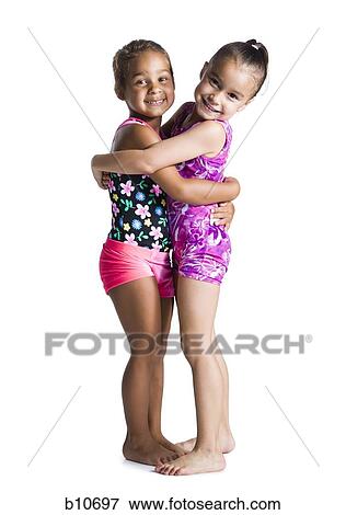 Young female gymnasts embracing View Large Photo Image Stock Photo - Young female gymnasts embracing. Fotosearch