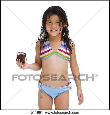 Young girl eating ice cream snack View Large Photo Image Stock Image - Young girl eating ice cream snack. Fotosearch