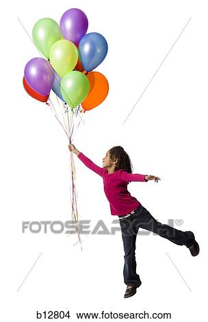 Picture - Young girl holding balloons. Fotosearch