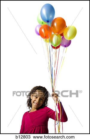 Young girl holding balloons View Large Photo Image Stock Image - Young girl holding balloons. Fotosearch