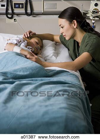 Young girl in hospital bed with nurse View Large Photo Image Stock Photo - Young girl in hospital bed with nurse. Fotosearch