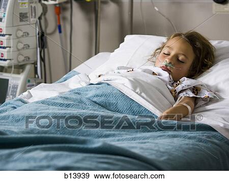Young girl in hospital bed with respirator View Large Photo Image Stock Photo - Young girl in hospital bed with respirator. Fotosearch