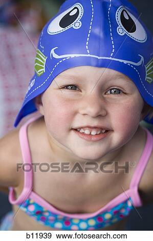 Young girl in swimming cap View Large Photo Image Stock Photo - Young girl in swimming cap. Fotosearch