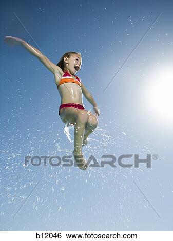 Young girl jumping in water View Large Photo Image Stock Photograph - Young girl jumping in water. Fotosearch