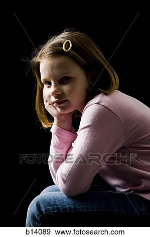 Young girl leaning on hand seated View Large Photo Image Stock Photo - Young girl leaning on hand seated. Fotosearch