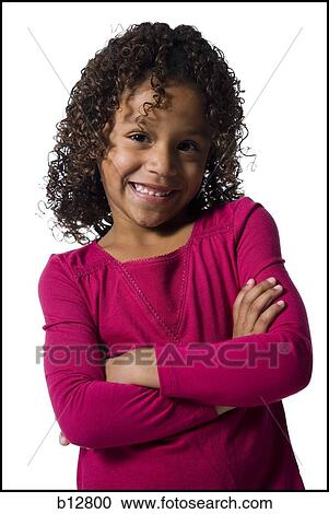 Stock Image - Young girl with crossed arms. Fotosearch