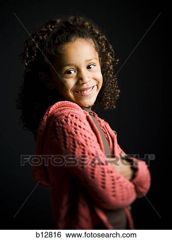 Young girl with crossed arms View Large Photo Image Stock Photograph - Young girl with crossed arms. Fotosearch