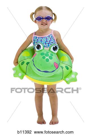 Young girl with inflatable flotation device around waist View Large Photo Image Stock Image - Young girl with inflatable flotation device around waist. Fotosearch